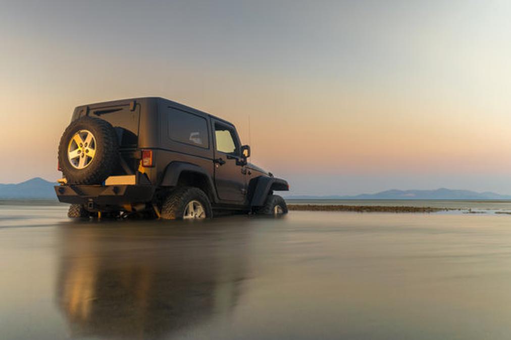 Car 4x4 in the mud doing sports against the sunset. - Image of Automotive, off-roading