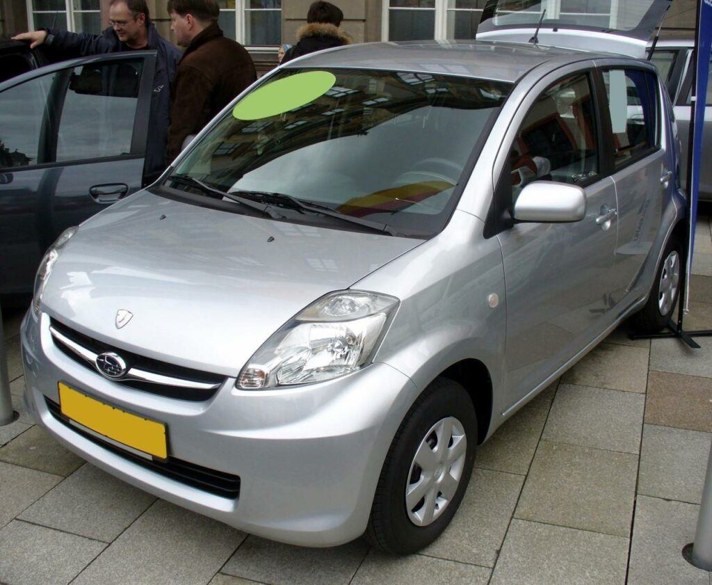 File:Subaru Justy Trend 1.0 Silver.JPG - a silver car parked in front of a building